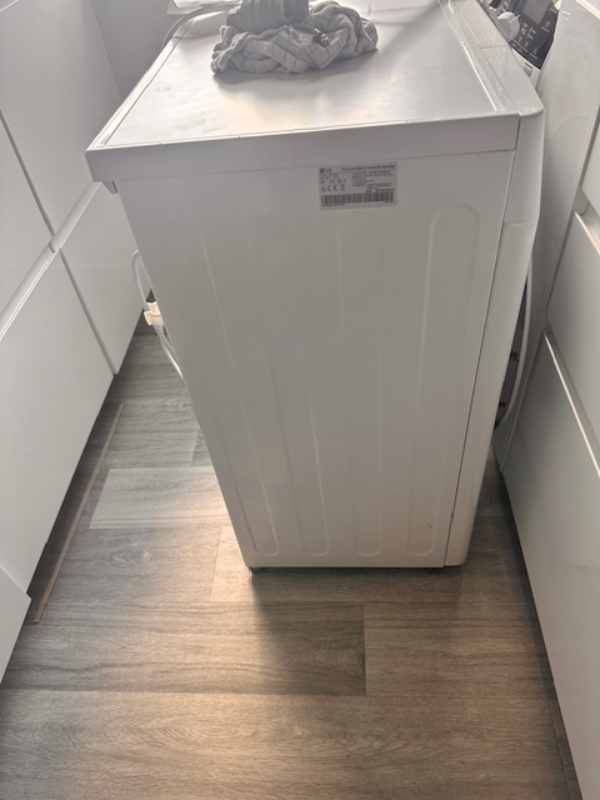 Nedbæring og transport af en SLIM vaskemaskine