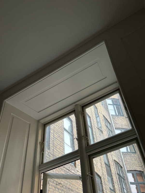 Install two blackout curtains