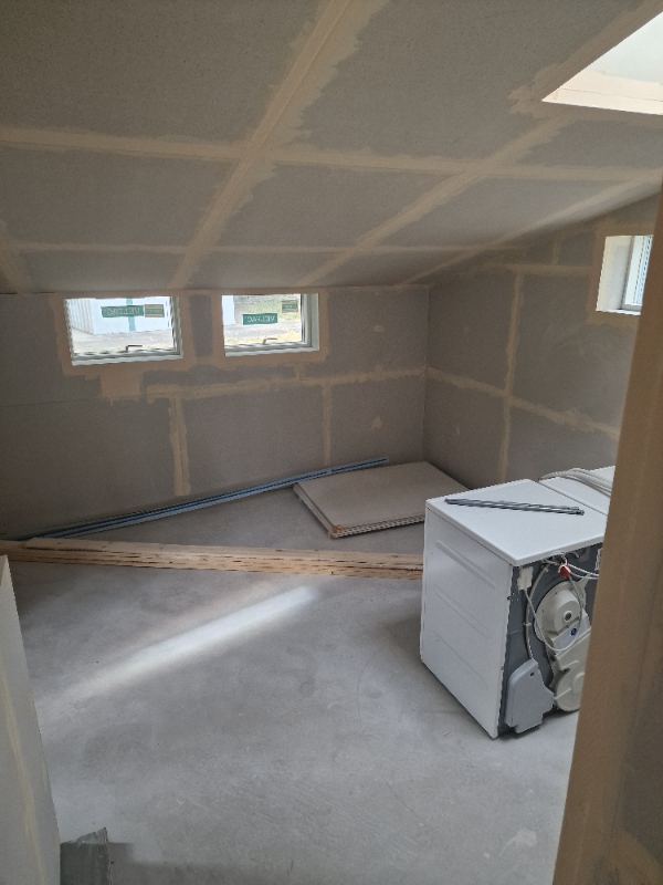 Laying tiles in our bryggers