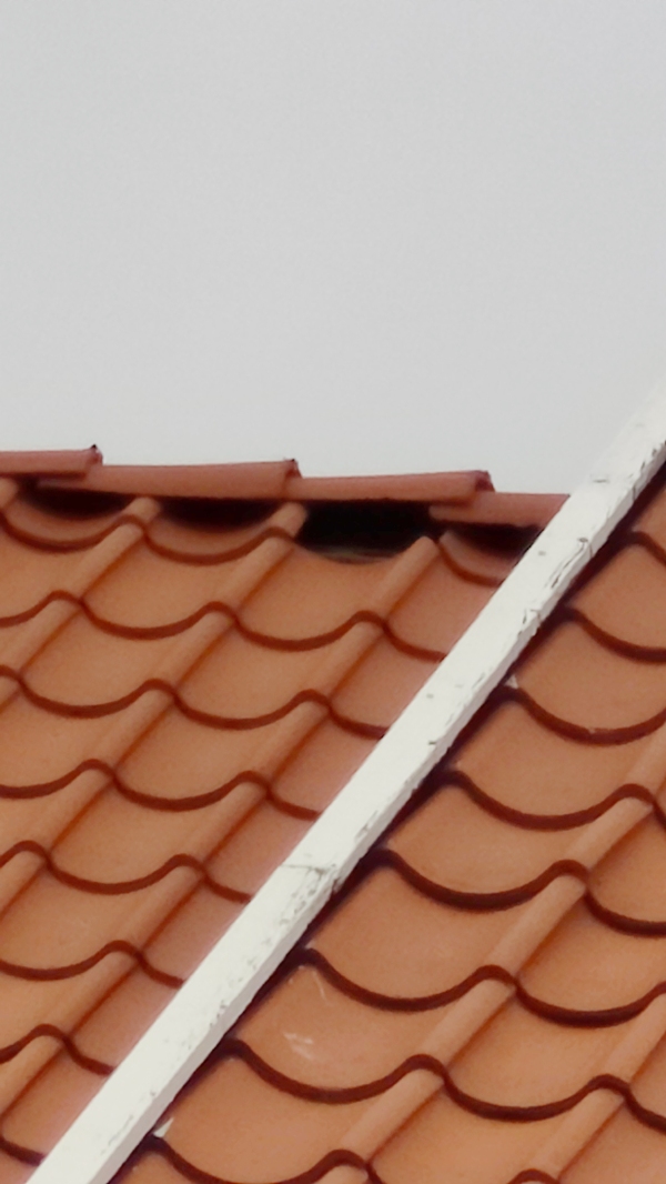 Montering og tilpasning af én tagsten