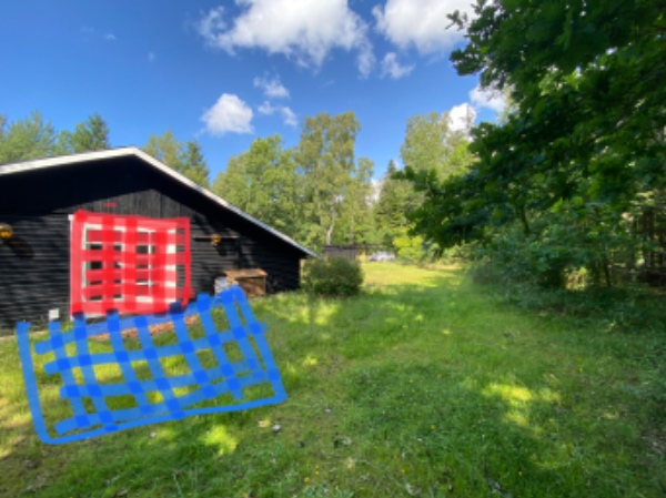 Anlagt terrasse med fliser i sommerhus