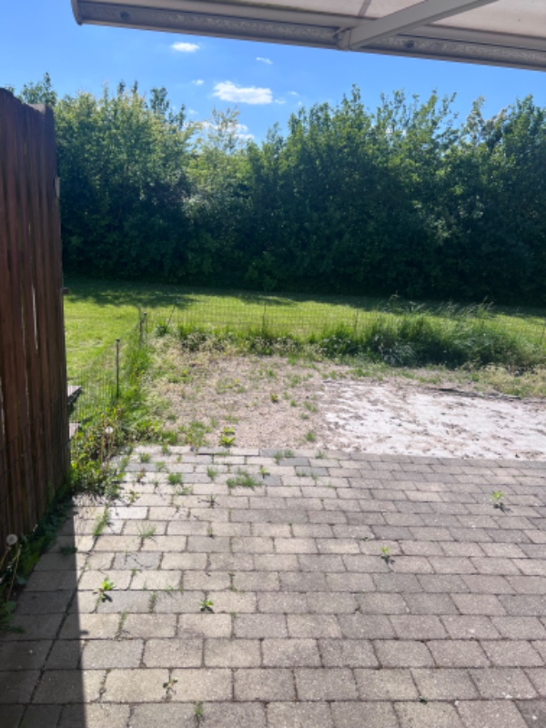 Fjernelse af grus og sand i have