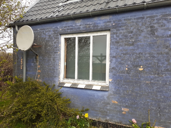 Maling af den pudsede del af huset