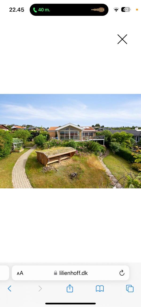 Skal have et murstenshus beklædt med Sort malet træ