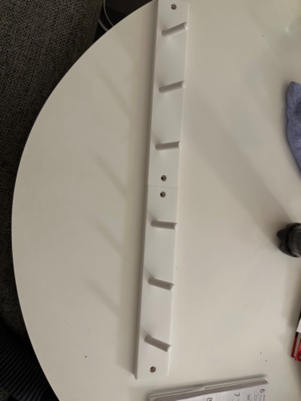 Hænge to små knagerækker op