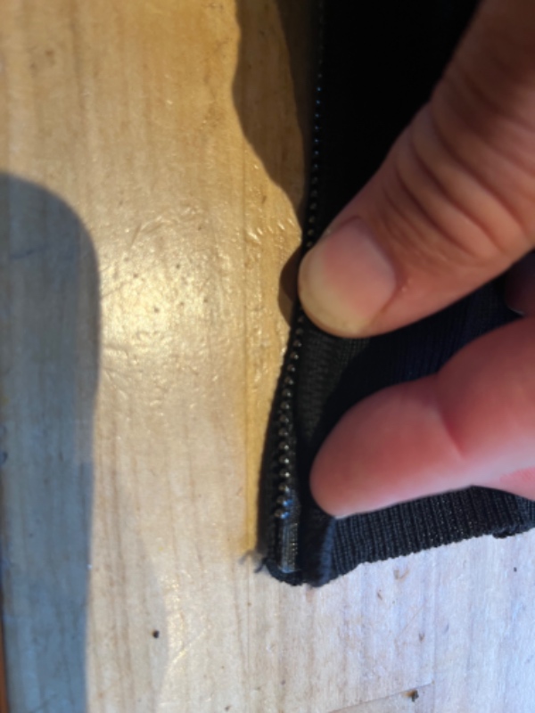 Reparation af lynlås på trøje