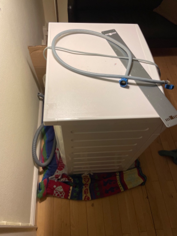 Afhente vaskemaskine og køres til genbrugsplads