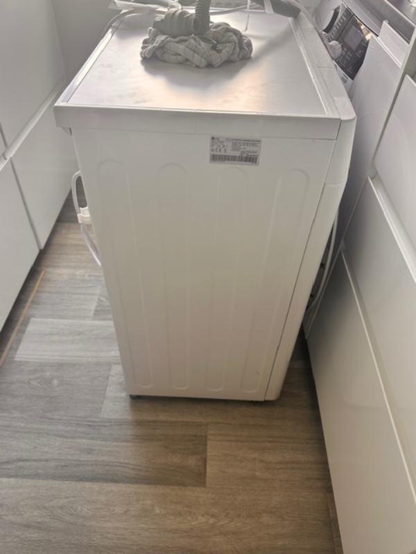 Nedbæring og transport af en SLIM vaskemaskine