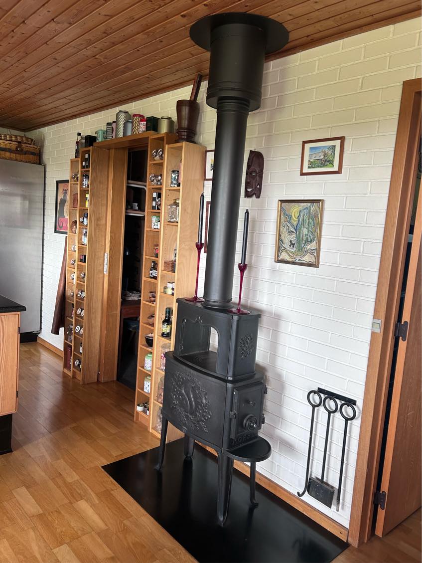 Nedtag brændeovn og lap hul i loft og tag