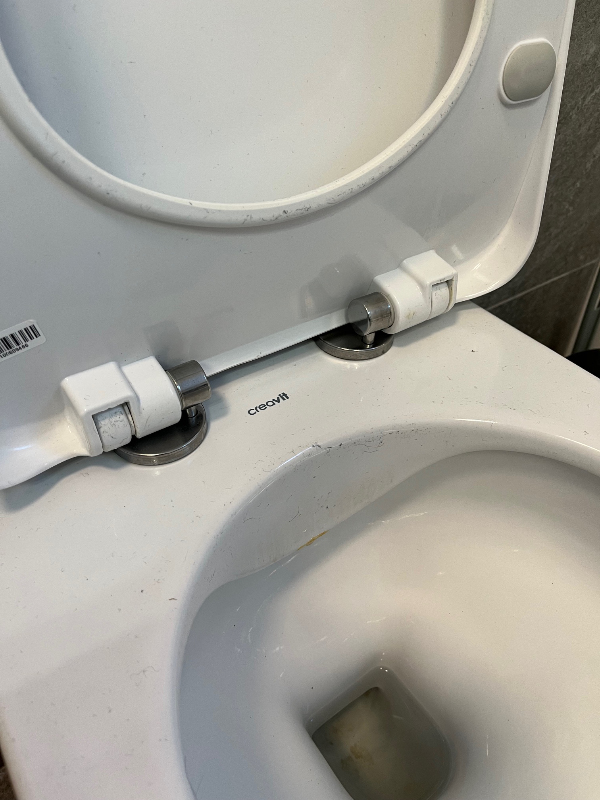 Stramning af toiletsæde