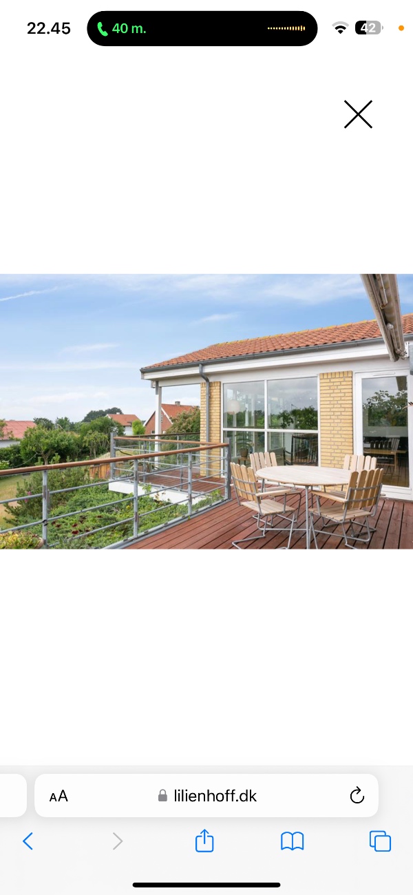 Skal have et murstenshus beklædt med Sort malet træ